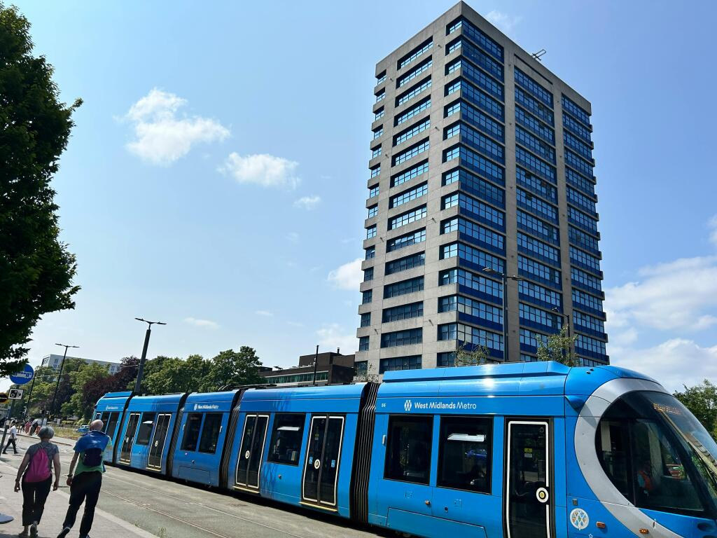 The Chapman Tate Associates office building on Hagley Road, Birmingham, with a West Midlands Metro tram