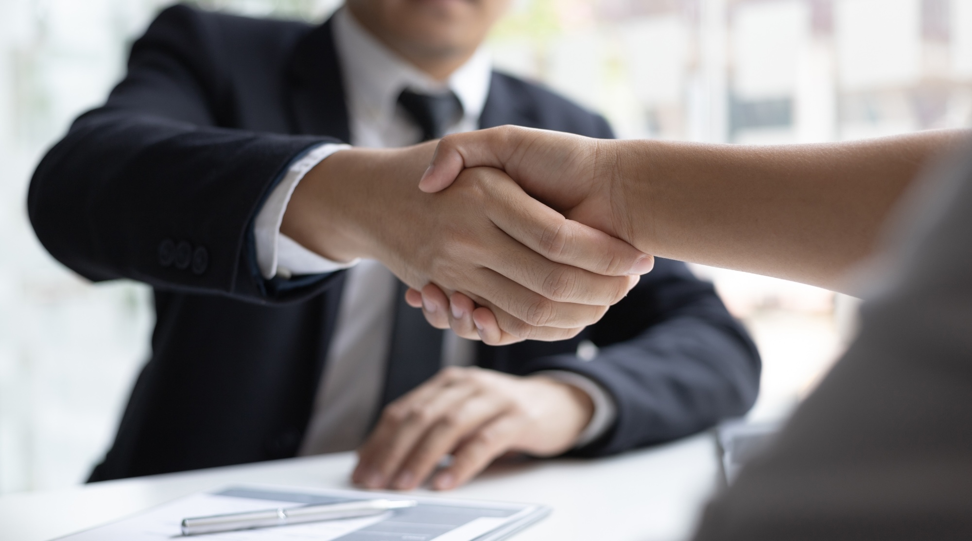 Permanent recruitment consultant meeting a client